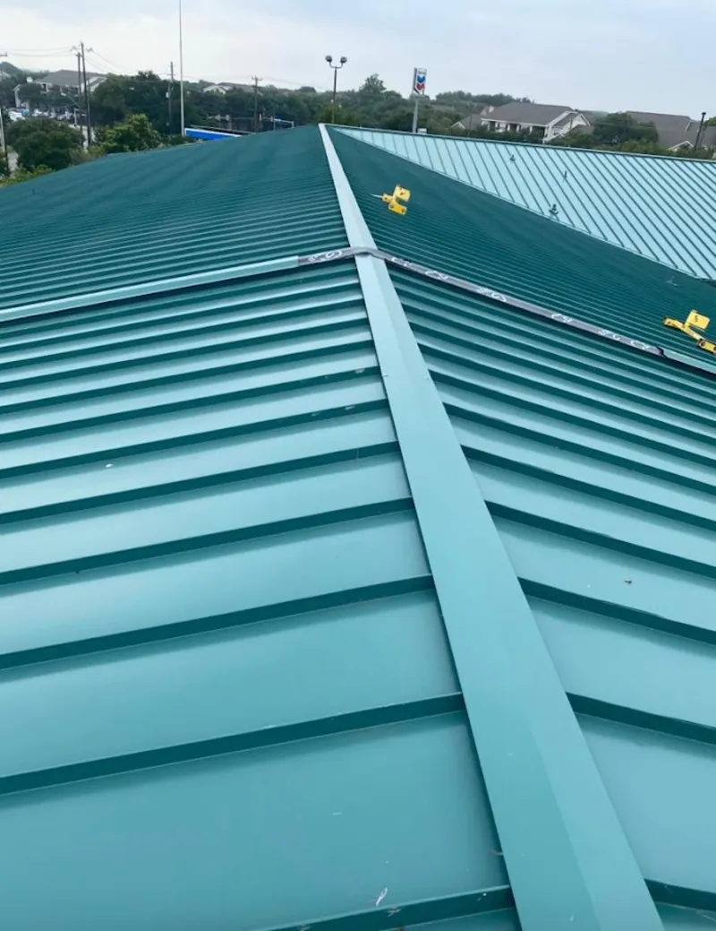 Green commercial metal roof ridge and valley for Metal Roof Repair in Williamson